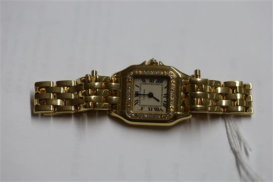 A ladys modern 18ct gold and diamond Cartier Panthere quartz wrist watch,